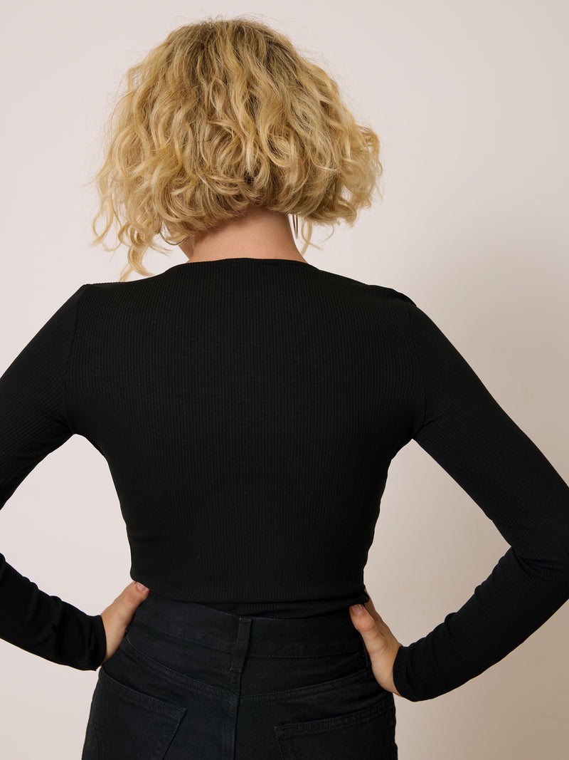PAULANE black ribbed long-sleeve top, side view by Rouje