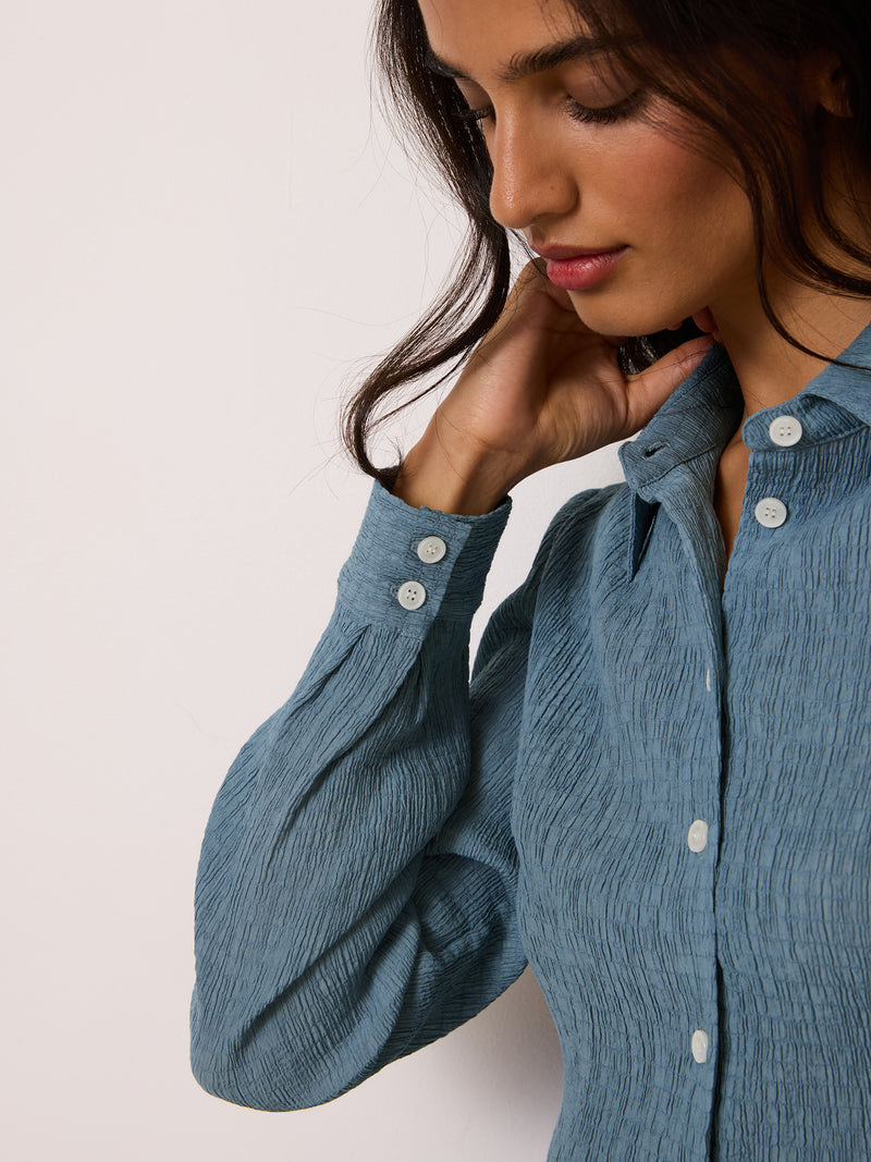 PALMYRA denim blue crinkle shirt, detail of pearlescent buttons by Rouje